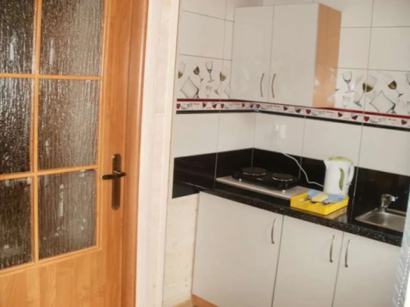 Domek piętrowy z mieszkaniami - kuchnia.